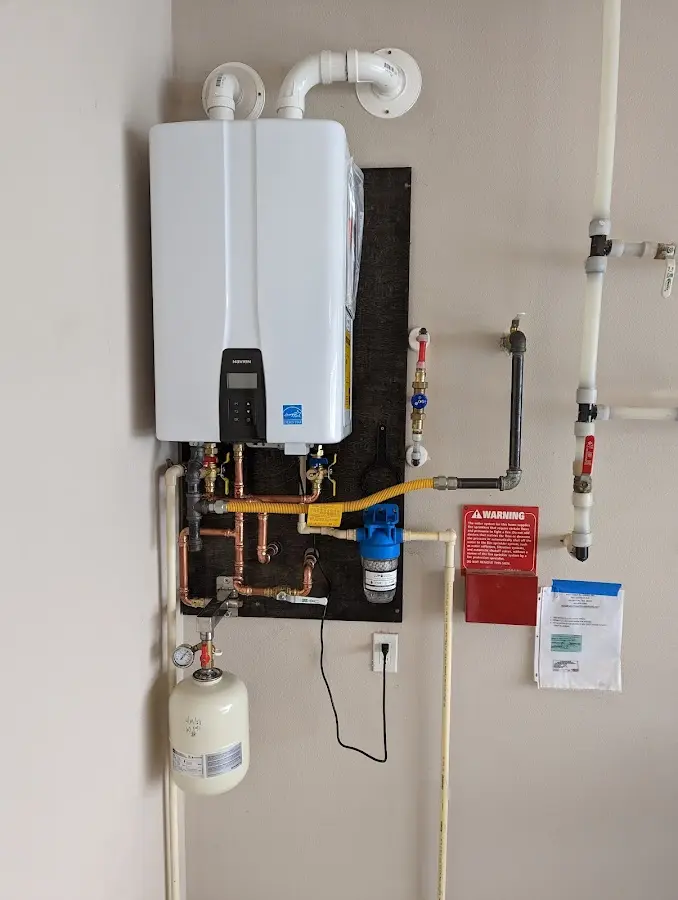 Professional plumber installing copper piping in a Natchez home