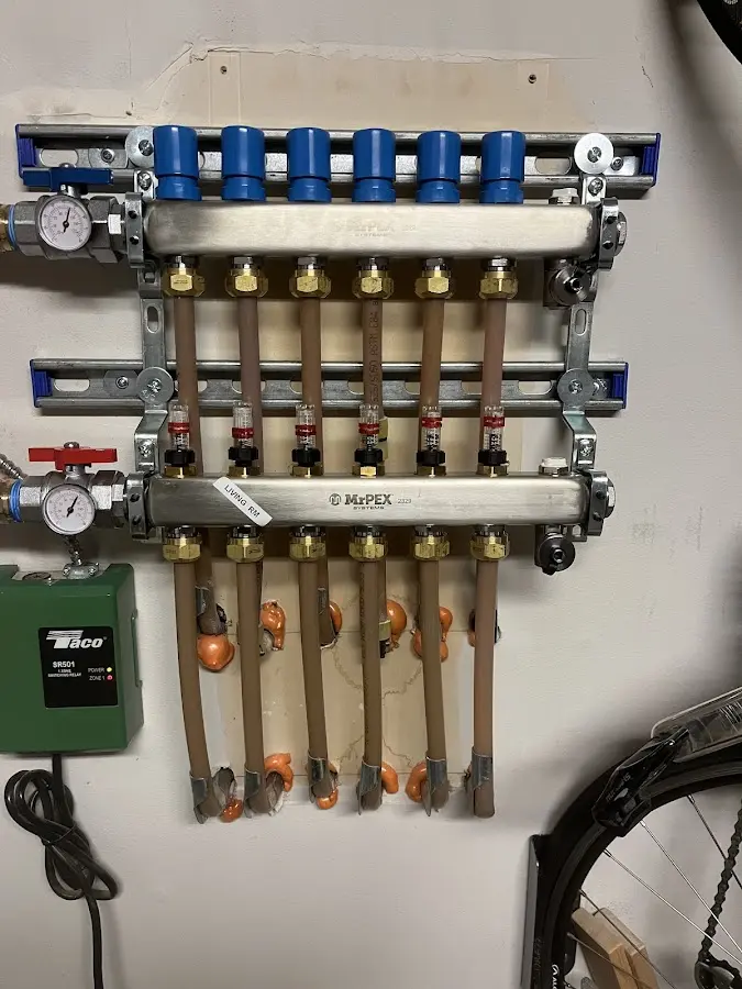 Plumber performing Water Heater Repair at a residential property in Natchez